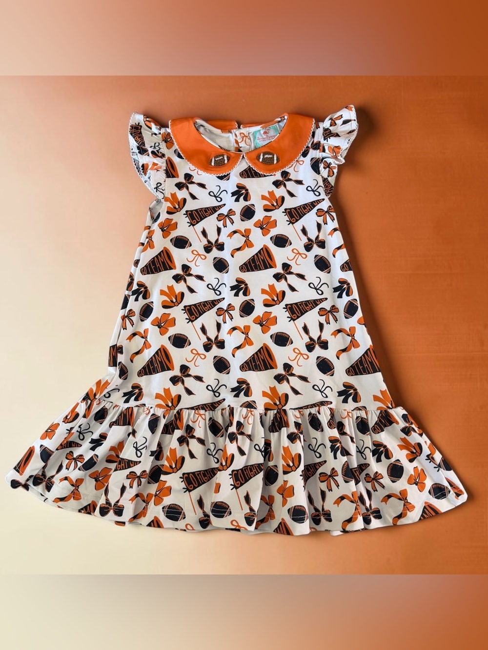 The Smocked Flamingo Orange & Nave French Knot Football Dress